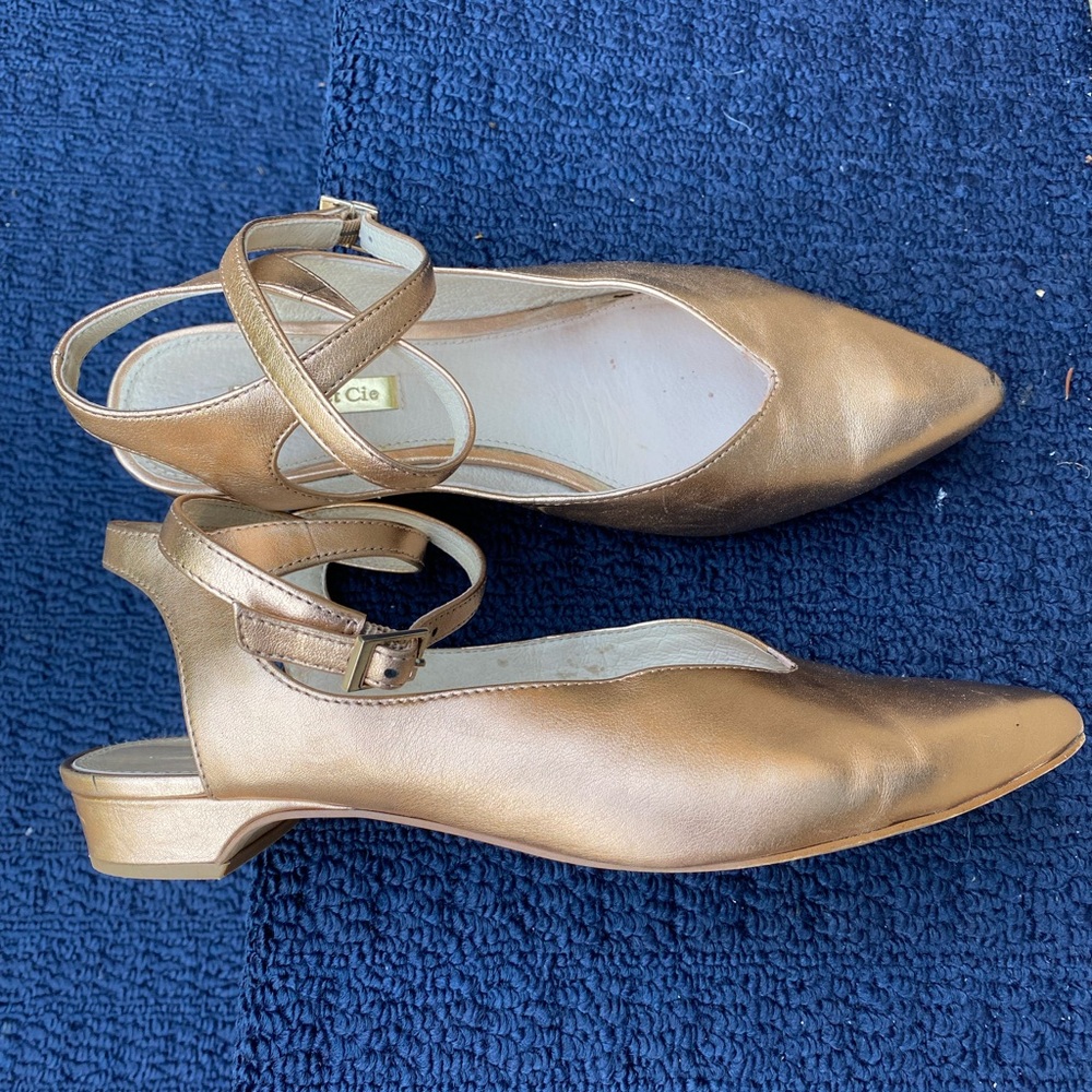 Rose gold pointy strap leather flats by Louise et Cie